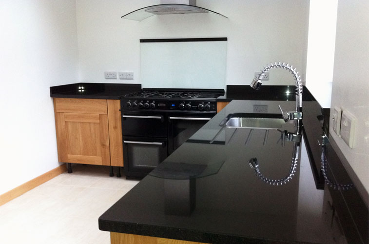 Indian Premium Black granite Kitchen – Featuring polished cut-out with drainer grooves and upstands Indian Premium Black granite Kitchen
