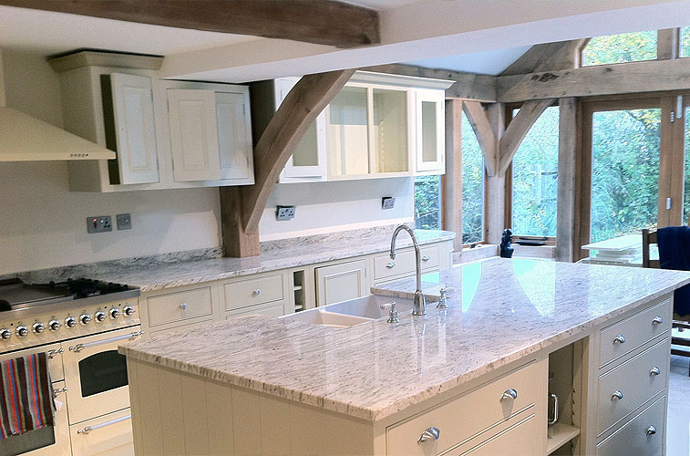 River White granite – Island with Belfast sink cut out. Kitchen by The Home and Kitchen Company River White granite