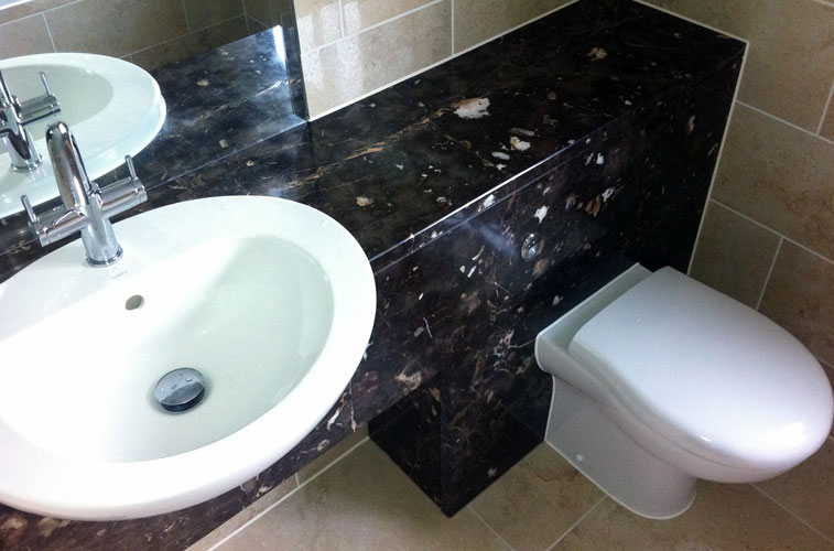 Marron Imperial Marble Bathroom – Featuring concealed cistern and semi-recessed basin Marron Imperial Marble Bathroom - Featuring concealed cistern and semi-recessed basin